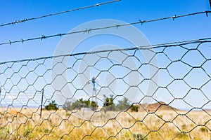 Windmill on a farm in rural grassland area of South Africa