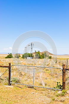 Windmill on a farm in rural grassland area of South Africa