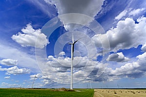 Windmill farm turbines with beautiful grey white