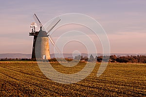 Windmill on a field at Little Milton, Oxfordshire, United Kingdom during sunset