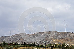 Windmill generators along a road in Sicily. Energy conservation.