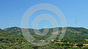 Windmill on a hill producing renewable energy from wind