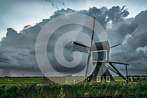 Windmill in Holland with Approaching Thunderstorm