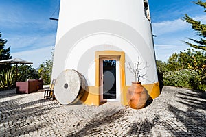 Windmill house on blue sky background