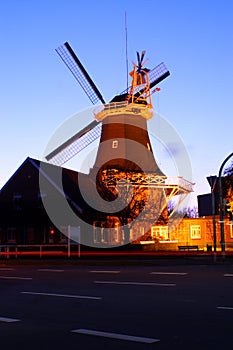 Windmill illuminated at night