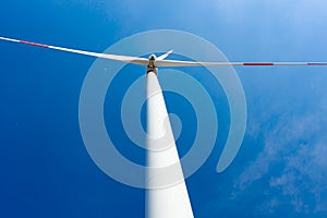 Windmill, large wind power turbines spinning to generating clean renewable energy