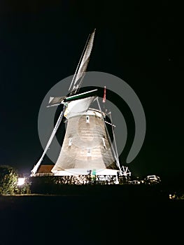 Windmill in the lights at Molenviergang Tweemanspolder