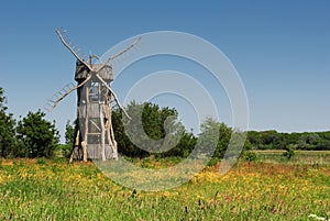 Windmill like viewpoint in meadow