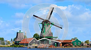 windmill near canal in the old Holland