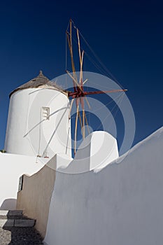 Windmill of Oia town at sunny day, Santorini