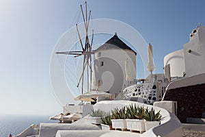 Windmill of Oia town at sunny day, Santorini