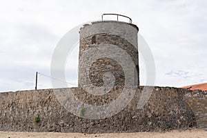 Windmill old mill without blades on the beach