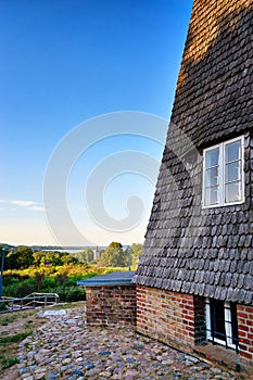 Windmill overlooking the church in Benz on the island of Usedom. Germany