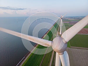 Windmill park in the ocean, drone aerial view of windmill turbines generating green energy electric, windmills isolated