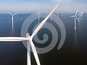 Windmill park westermeerdijk Netherlands, wind mill turbine with blue sky in ocean, green energy