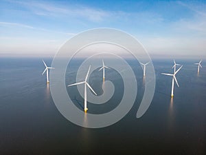 Windmill park westermeerdijk Netherlands, wind mill turbine with blue sky in ocean, green energy