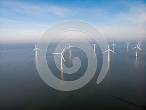 Windmill park westermeerdijk Netherlands, wind mill turbine with blue sky in ocean, green energy