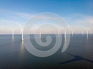 Windmill park westermeerdijk Netherlands, wind mill turbine with blue sky in ocean, green energy