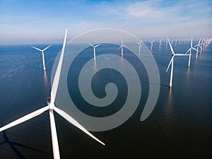 Windmill park westermeerdijk Netherlands, wind mill turbine with blue sky in ocean, green energy