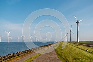 Windmill park westermeerdijk Netherlands, wind mill turbine with blue sky in ocean, green energy