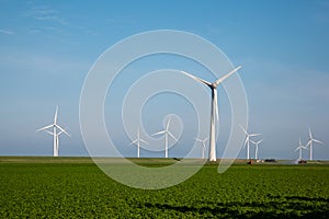 Windmill park westermeerdijk Netherlands, wind mill turbine with blue sky in ocean, green energy