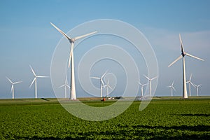 Windmill park westermeerdijk Netherlands, wind mill turbine with blue sky in ocean, green energy