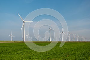 Windmill park westermeerdijk Netherlands, wind mill turbine with blue sky in ocean, green energy