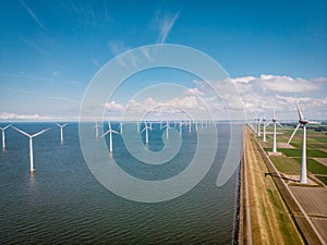 Windmill park westermeerdijk Netherlands, wind mill turbine with blue sky in ocean, green energy