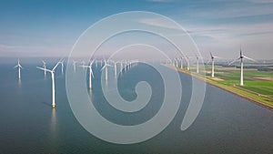 Windmill park westermeerdijk Netherlands, wind mill turbine with blue sky in ocean, green energy