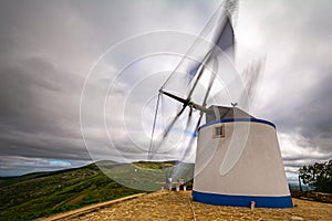 Windmill in Portuguese Mountain. Moinho de vento em paisagem Portuguesa.