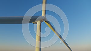 Windmill propeller rotating in closeup. Wind turbine producing renewable energy.