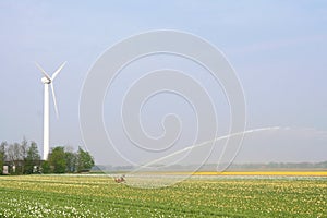 Modern wind turbine provides alternative energy for irrigation, Netherlands photo