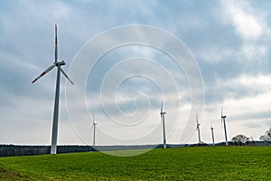 Windmill in a rural area. offshore wind park. Wind Turbines Farm. Alternative renewable energy generation. green energy