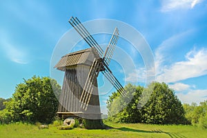 Windmill. Rural nature landscape with old wooden mill