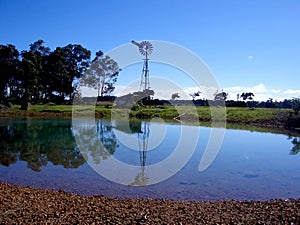 Windmill, shed and pond
