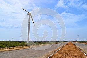 Windmill on side of Highway in India - Wind Power - Sustainable Renewable Energy