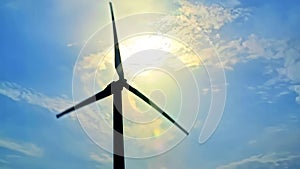 Windmill Silhouette on Cloudy Blue Sky Background