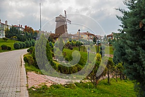 Windmill with sky as background. Sculpture of don Quixote and Sancho Panza. Selale Park, Eskisehir, Turkey