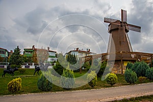 Windmill with sky as background. Sculpture of don Quixote and Sancho Panza. Selale Park, Eskisehir, Turkey