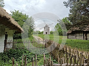 A windmill stands as a nostalgic sentinel in a recreated city