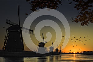 Windmill sunrise silhouette