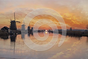 Windmill sunrise silhouette