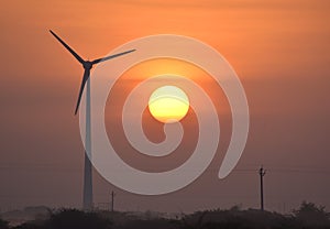 Windmill and Sunrise solar energy and wind energy