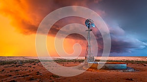 Windmill in a Thunderstorm at Sunset