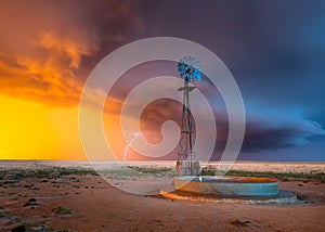 Windmill in a Thunderstorm at Sunset