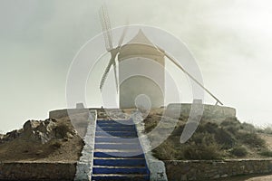 Windmill On Top Of Cerro Calderico Surrounded By Thick Fog In Consuegra. December 26, 2018. Consuegra Toledo Castilla La Mancha