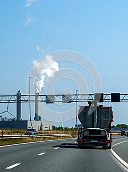 windmill truck highway road Europe Netherlands urban traffic smoke pollution