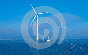 Windmill turbines at sea a huge winmill park in the Netherlands during winter