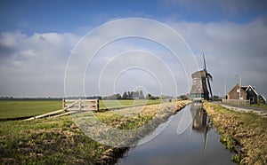 Windmill in a typical Dutch landscape