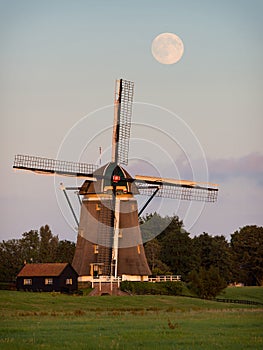 Windmill under a full moon
